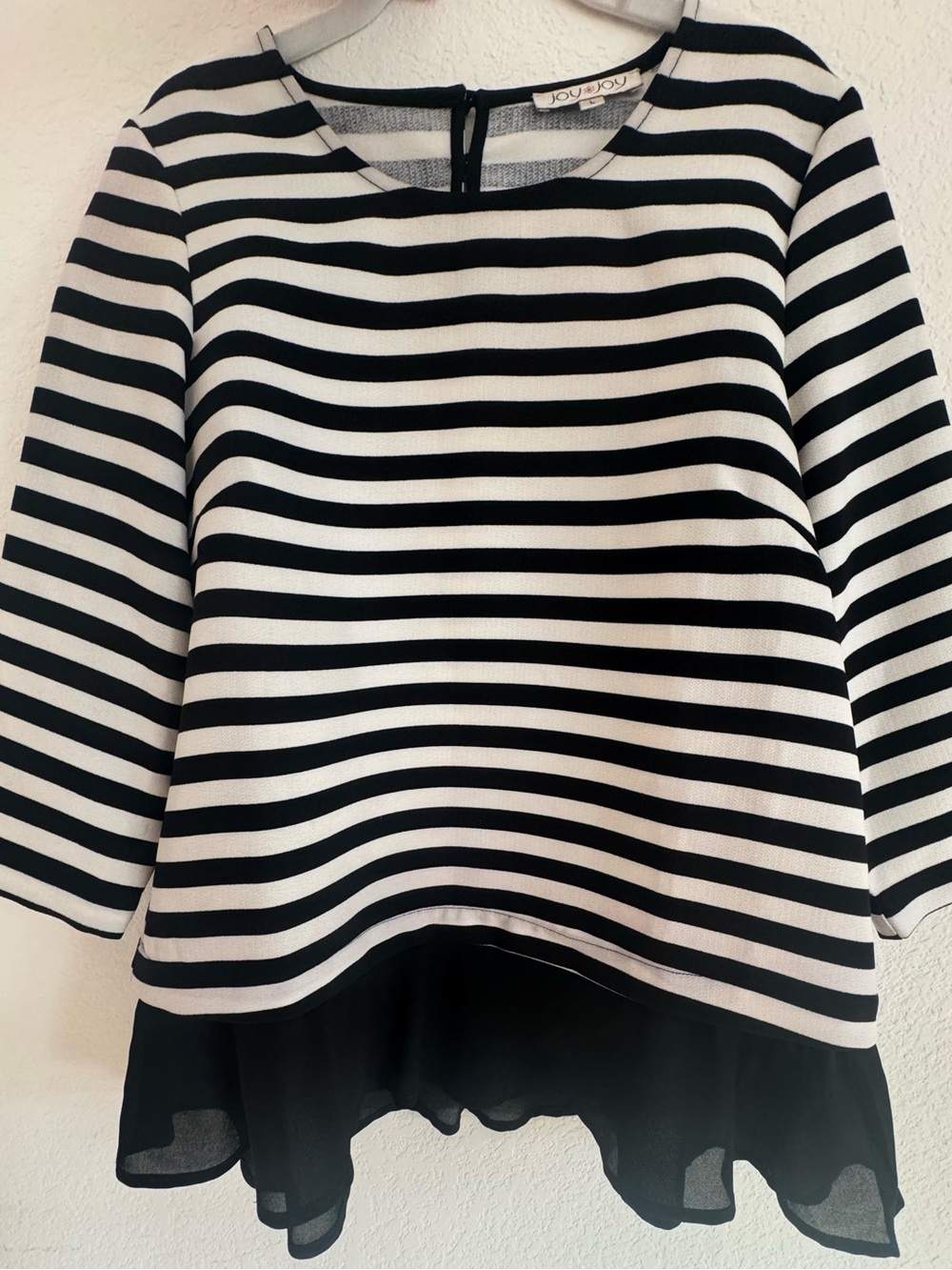 Striped black and white shirt with a ruffle